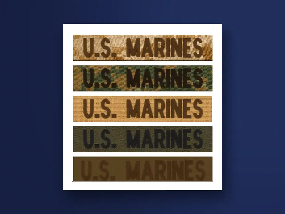 Five embroidered U.S. Marines tapes in MARPAT and solid colorways